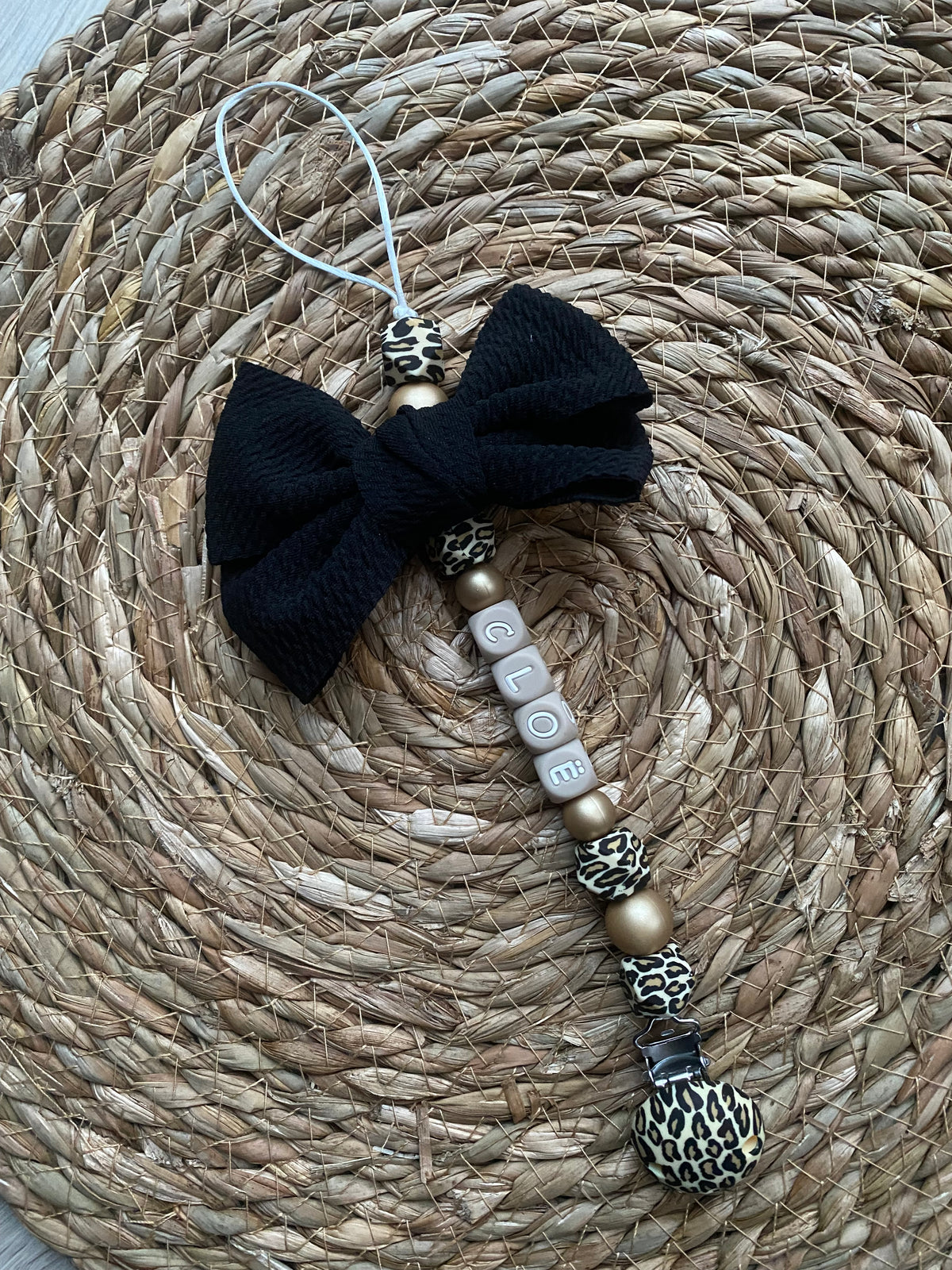 Speenkoord met strik panter / goud / zwart