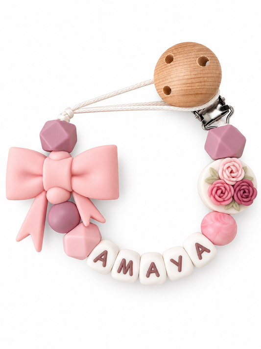 Speenkoord met naam roosjes / strik / roze