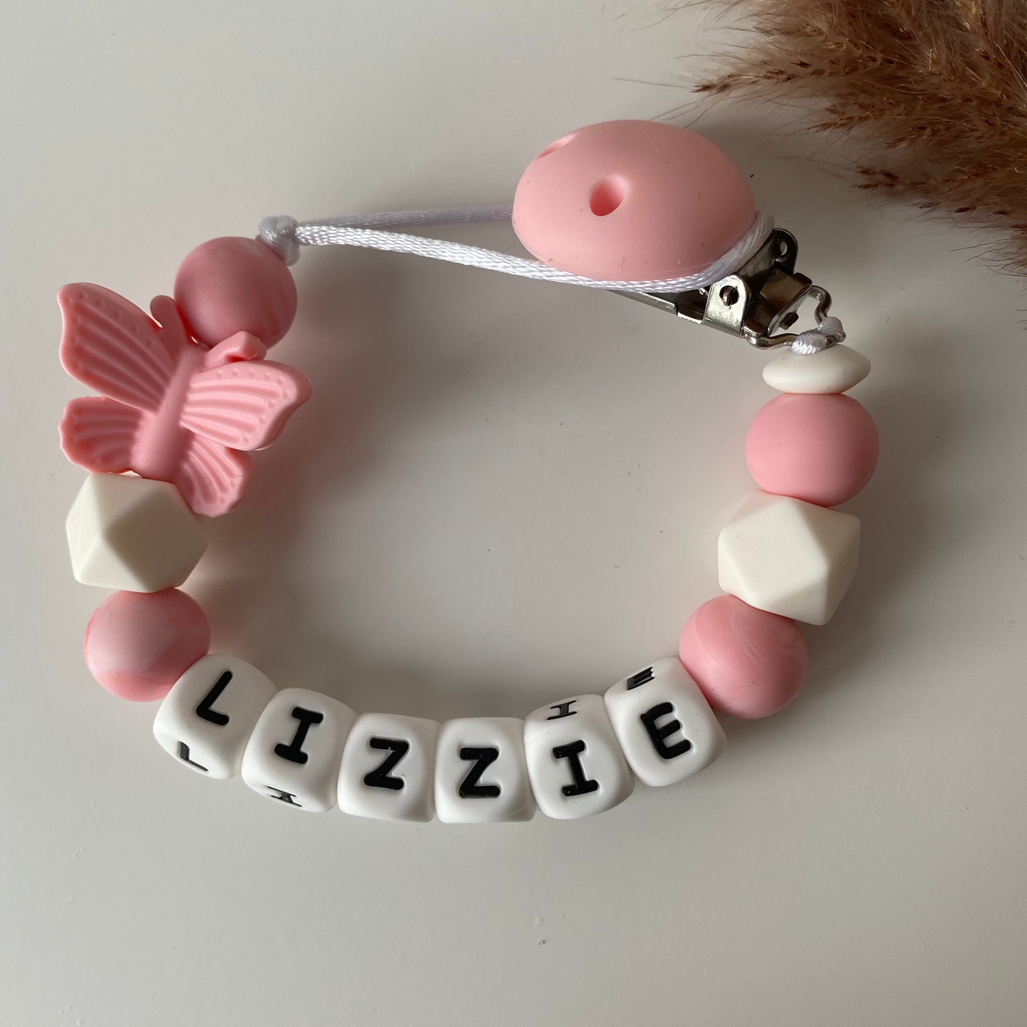 Speenkoord met naam roze vinder